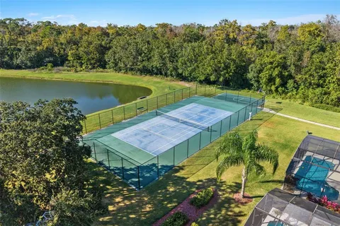an aerial view of a houses with yard