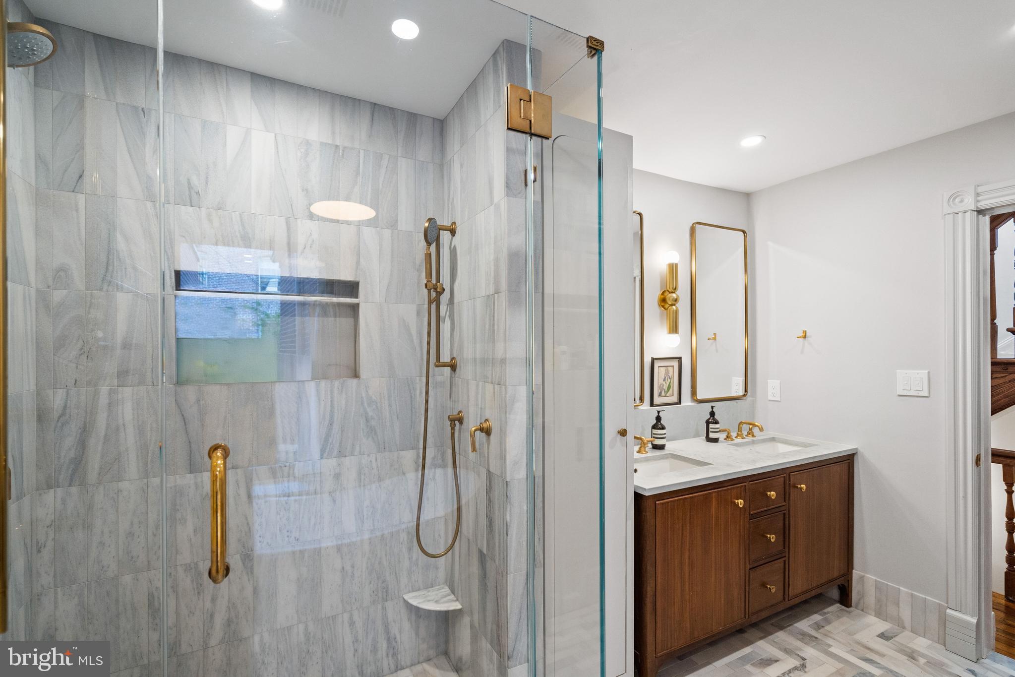 2026 15th Street Northwest Washington, DC 20009 - Photo 26 of 47 a bathroom with a double vanity sink a mirror and shower