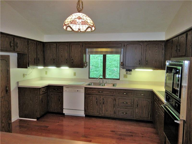 242 Boyd Road Freeport, PA 16229 - Photo 3 of 25 The kitchen features include fresh paint, new hardwood floors, a cathedral ceiling, a pantry, under cabinet lighting, and the dishwasher, electric cooktop stove and oven, refrigerator, and microwave are included with the sale of this home.