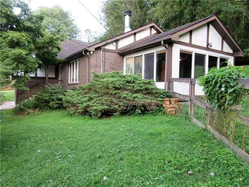 242 Boyd Road Freeport, PA 16229 - Photo 6 of 25 Side view of the home and four season room.