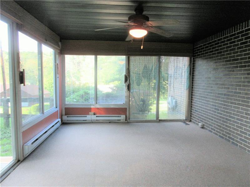242 Boyd Road Freeport, PA 16229 - Photo 10 of 25 Enjoy the view year round from this four season room that leads to a covered deck and fenced yard.