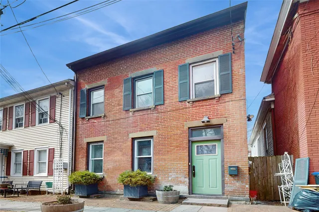a front view of a building with street view