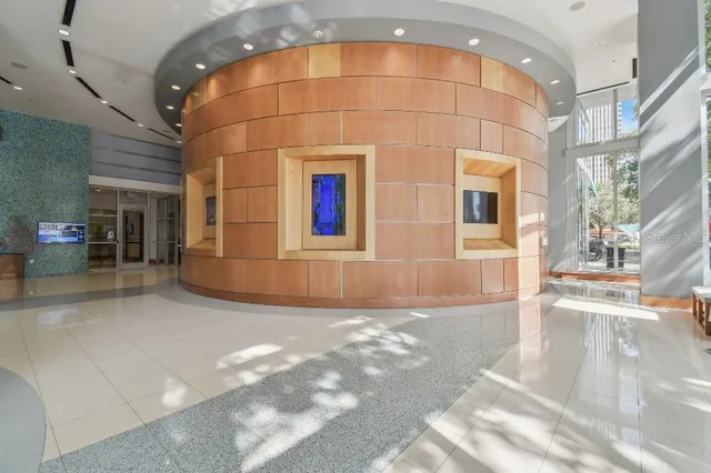 a front view of building with yard and outdoor seating