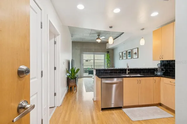 a kitchen with a sink stove and refrigerator