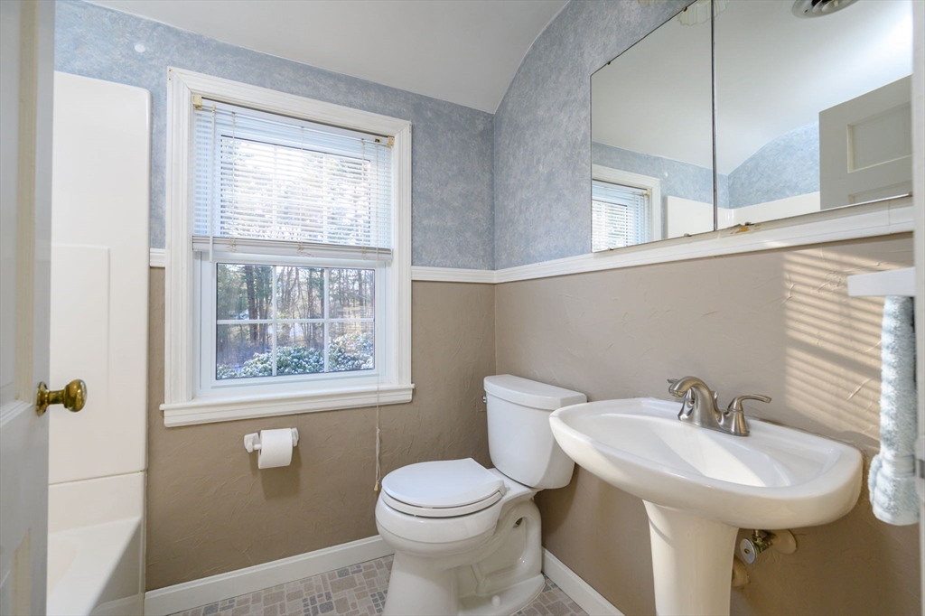 15 Autumn Circle Hingham, MA 02043 - Photo 19 of 38 a bathroom with a sink toilet and a window