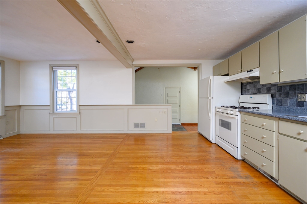 15 Autumn Circle Hingham, MA 02043 - Photo 5 of 38 a large white kitchen with cabinets
