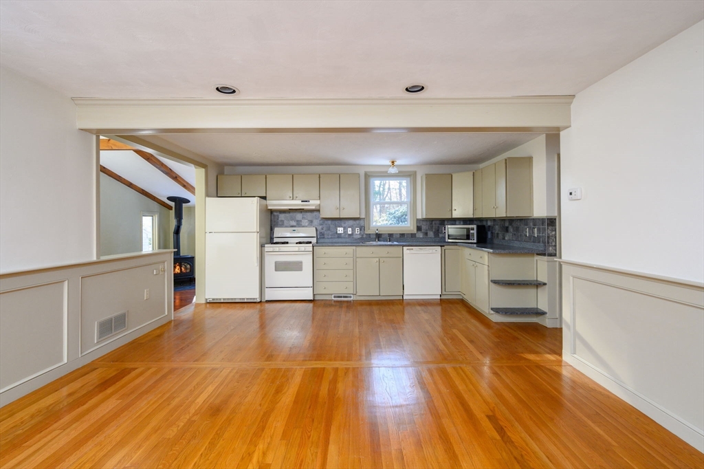 15 Autumn Circle Hingham, MA 02043 - Photo 6 of 38 a kitchen with wooden floors and refrigerator