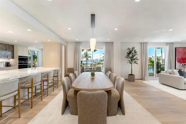 a dining room with furniture a window and kitchen view