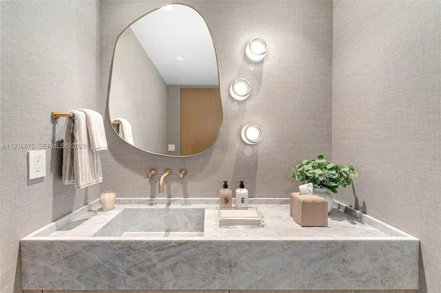 a bathroom with a sink a vanity and a mirror