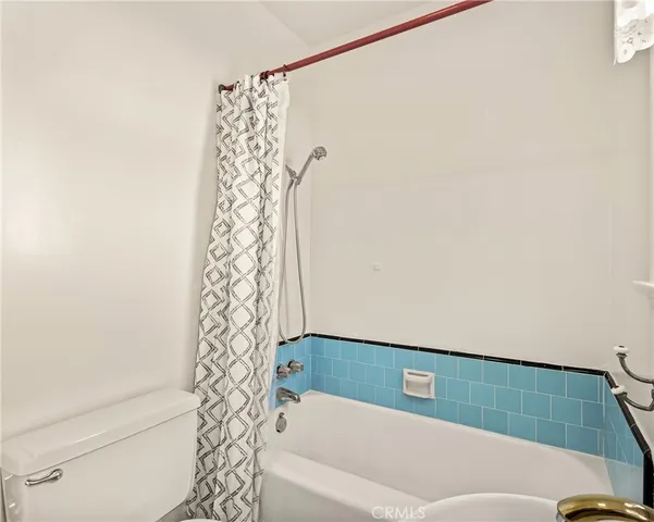 a bathroom with a bathtub and shower