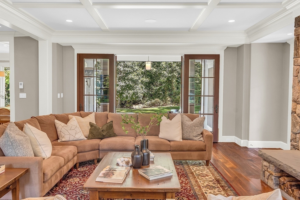 247 Independence Road Concord, MA 01742 - Photo 17 of 42 a living room with furniture and a large window