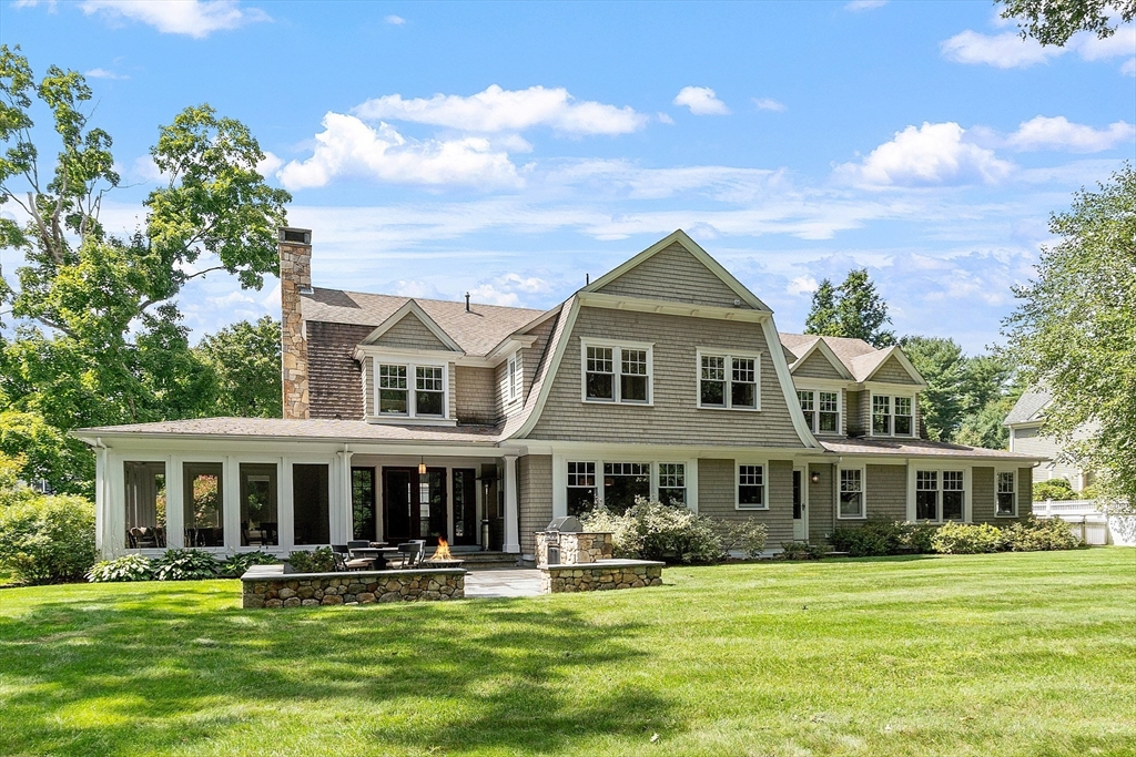 247 Independence Road Concord, MA 01742 - Photo 2 of 42 a front view of a house with a garden