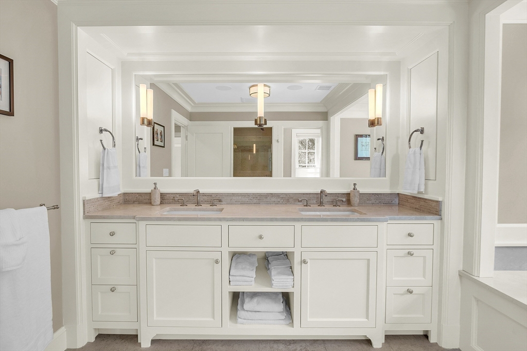 247 Independence Road Concord, MA 01742 - Photo 29 of 42 a bathroom with a granite countertop sink vanity and a mirror