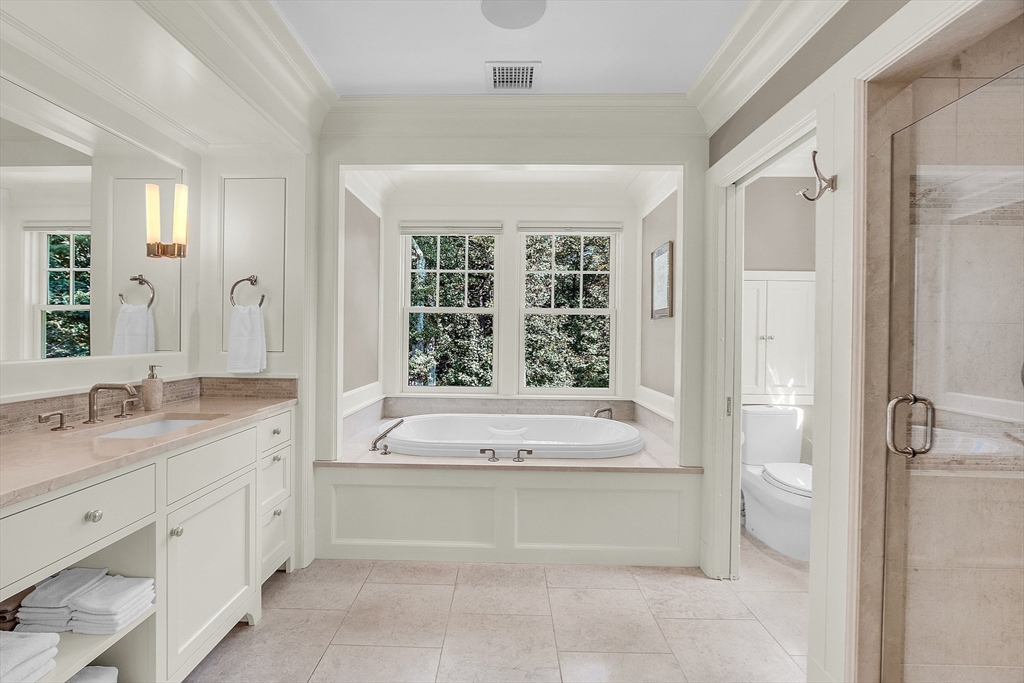 247 Independence Road Concord, MA 01742 - Photo 30 of 42 a spacious bathroom with a granite countertop tub sink and mirror
