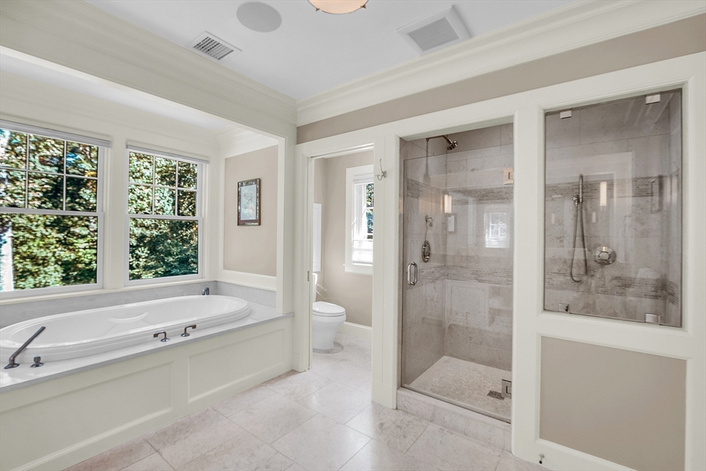 247 Independence Road Concord, MA 01742 - Photo 31 of 42 a bathroom with a tub shower sink and mirror
