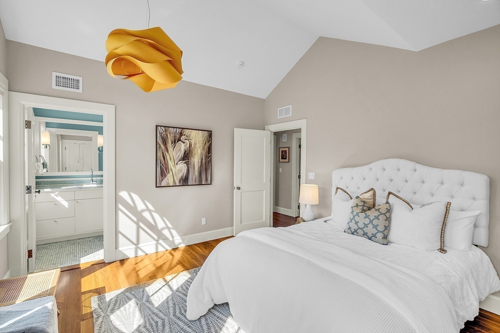 247 Independence Road Concord, MA 01742 - Photo 32 of 42 a bedroom with a bed and painting on the wall