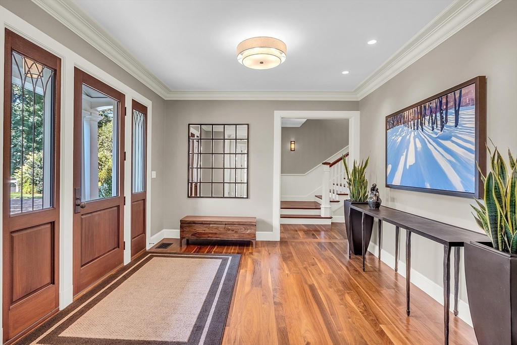 247 Independence Road Concord, MA 01742 - Photo 5 of 42 a living room with furniture and a wooden floor