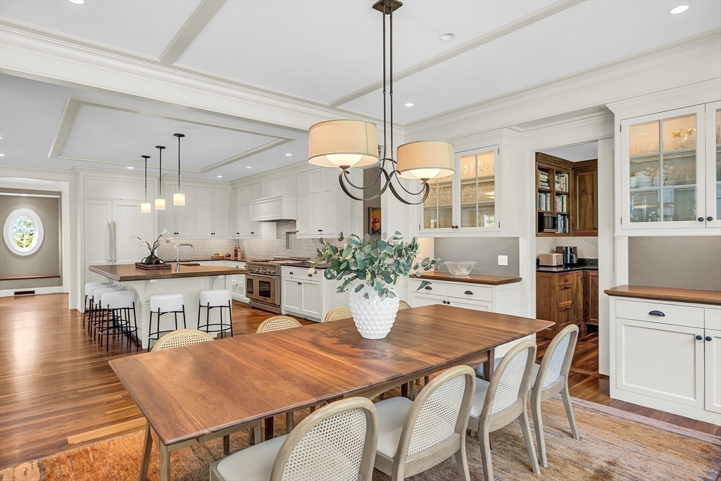 247 Independence Road Concord, MA 01742 - Photo 8 of 42 a dining room filled chandelier and wooden floor