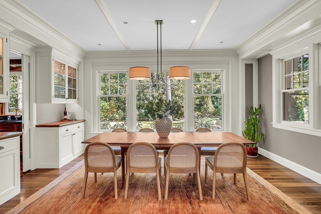 247 Independence Road Concord, MA 01742 - Photo 10 of 42 a view of a dining room with furniture window and wooden floor