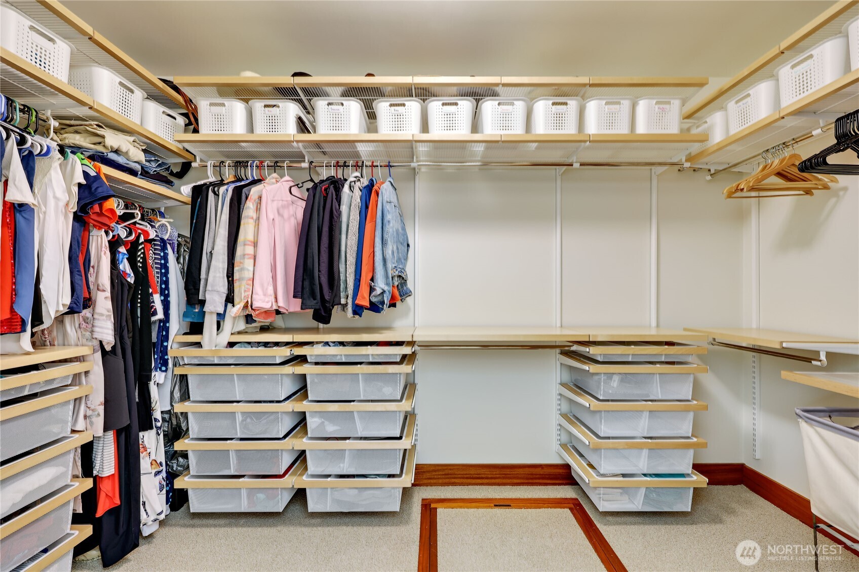7870 Northeast Koura Farm Drive Bainbridge Island, WA 98110 - Photo 25 of 39 a view of walk in closet with clothes and shoes