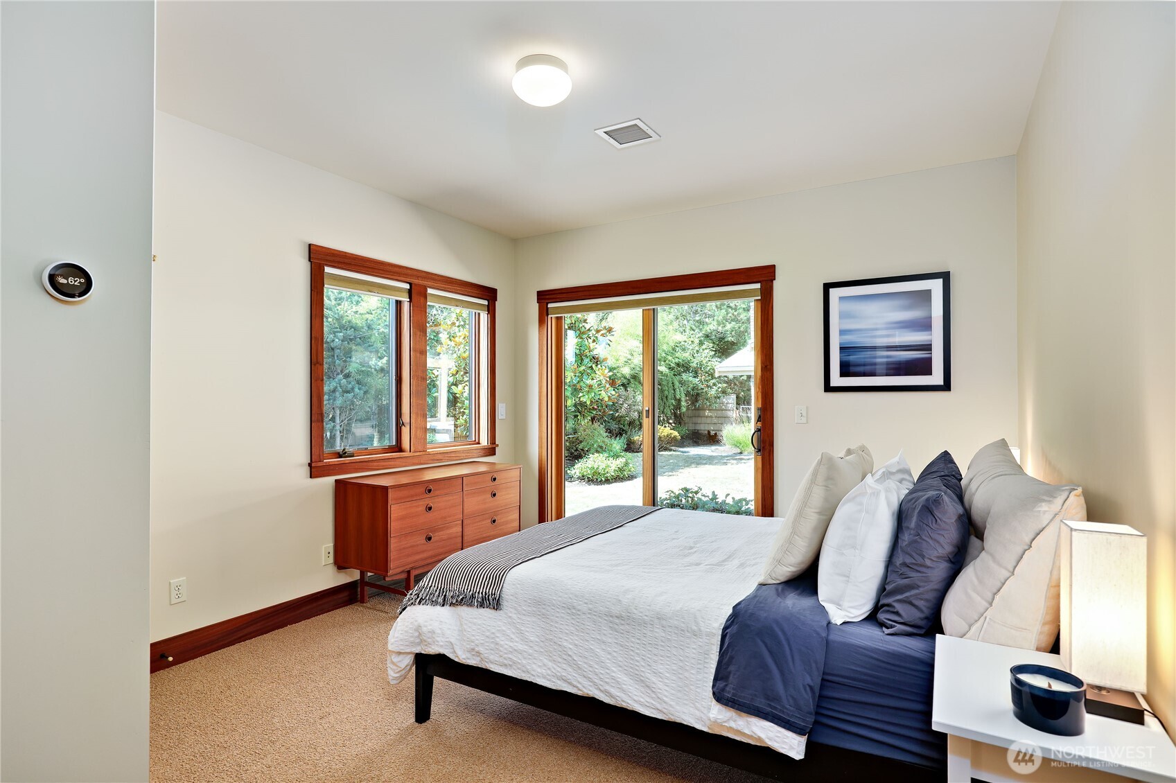 7870 Northeast Koura Farm Drive Bainbridge Island, WA 98110 - Photo 29 of 39 a bedroom with a large bed and a window