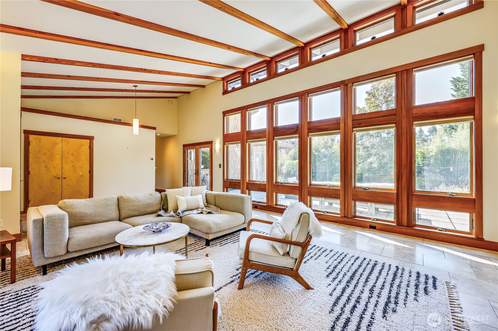 7870 Northeast Koura Farm Drive Bainbridge Island, WA 98110 - Photo 7 of 39 a living room with furniture and a large window