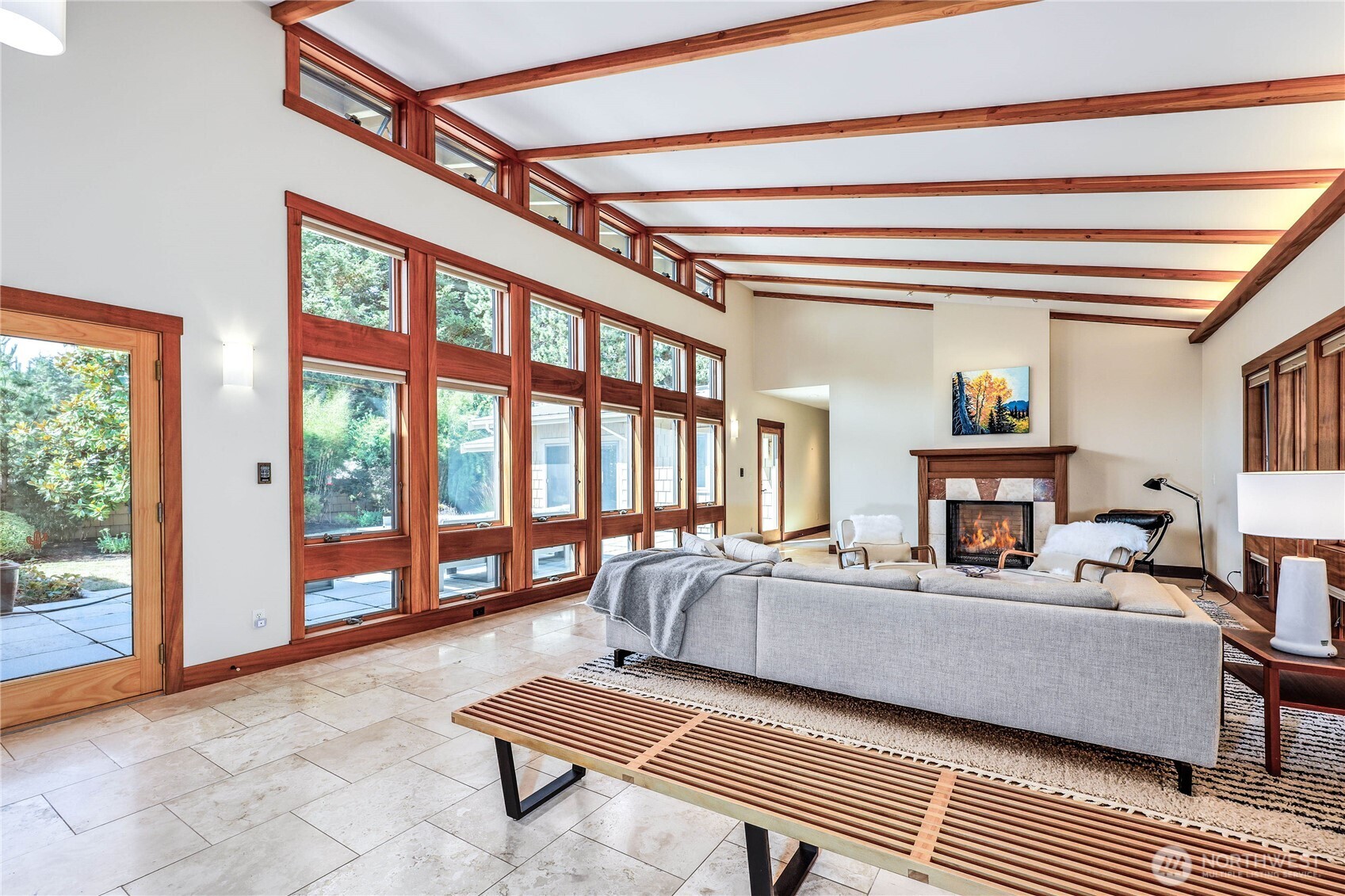 7870 Northeast Koura Farm Drive Bainbridge Island, WA 98110 - Photo 8 of 39 a living room with furniture and a floor to ceiling window