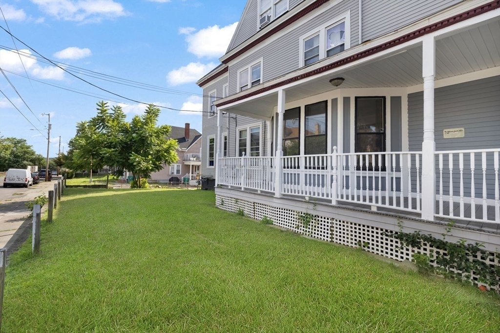 311 Elm Street Woonsocket, RI 02895 - Photo 6 of 29 a view of a house with a backyard