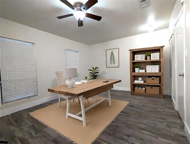 a room with a table chairs and wooden floor
