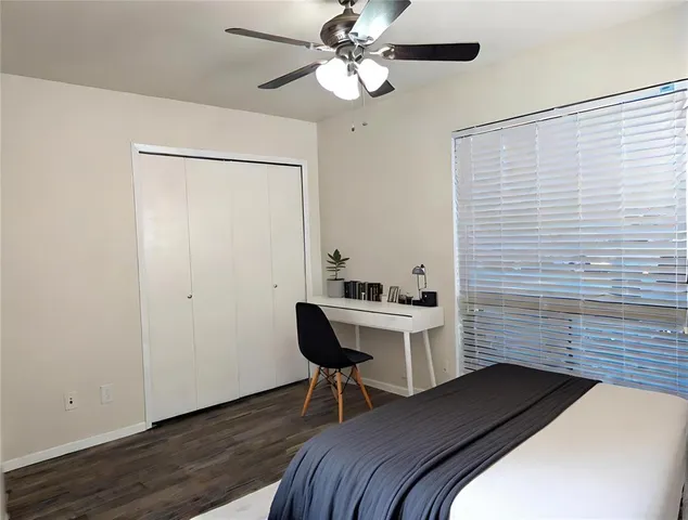 a bedroom with a bed and a table