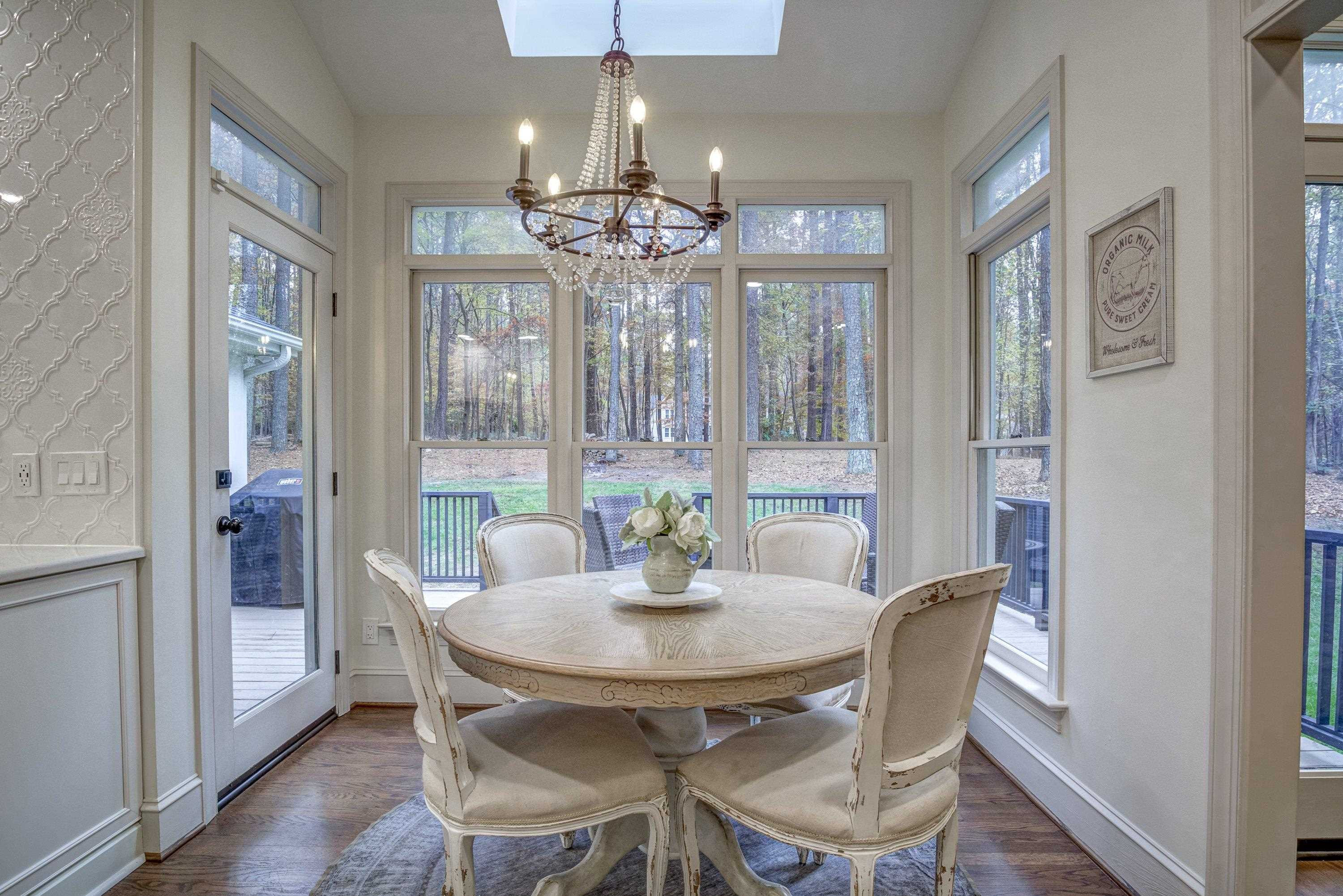 1413 Paumier Court Raleigh, NC 27615 - Photo 15 of 61 a view of a dining room with furniture and chandelier
