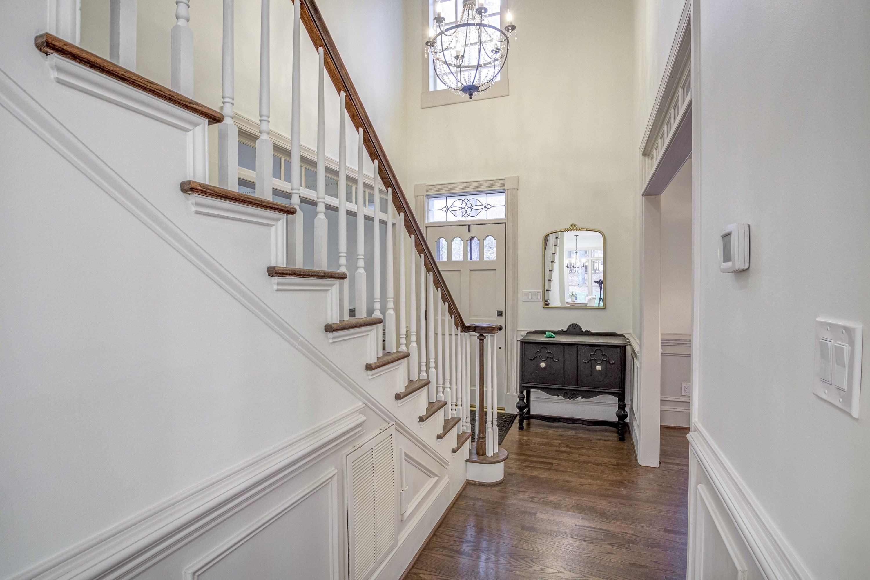 1413 Paumier Court Raleigh, NC 27615 - Photo 4 of 61 a view of entryway and hall with wooden floor