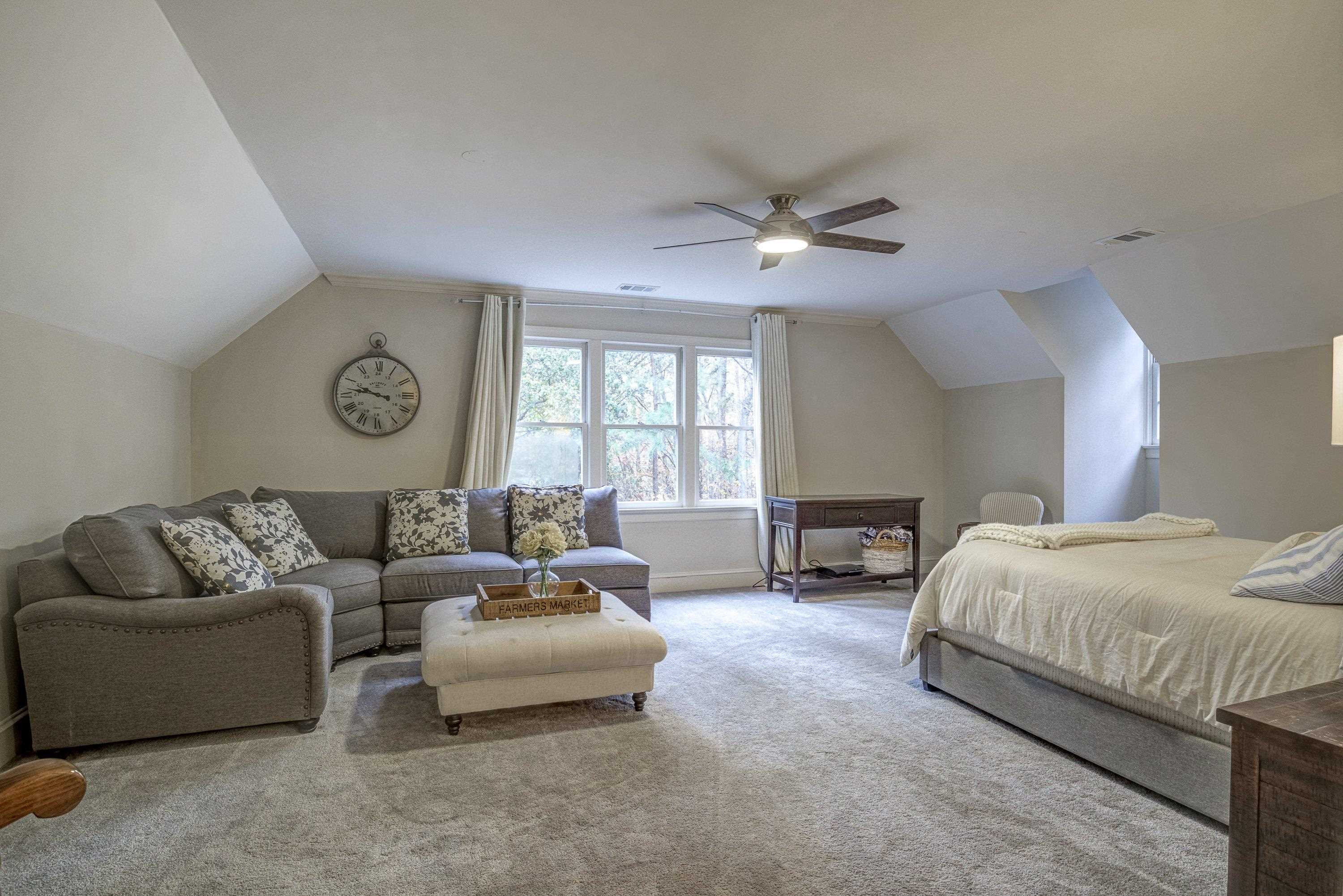 1413 Paumier Court Raleigh, NC 27615 - Photo 43 of 61 a spacious bedroom with a bed furniture and a large window