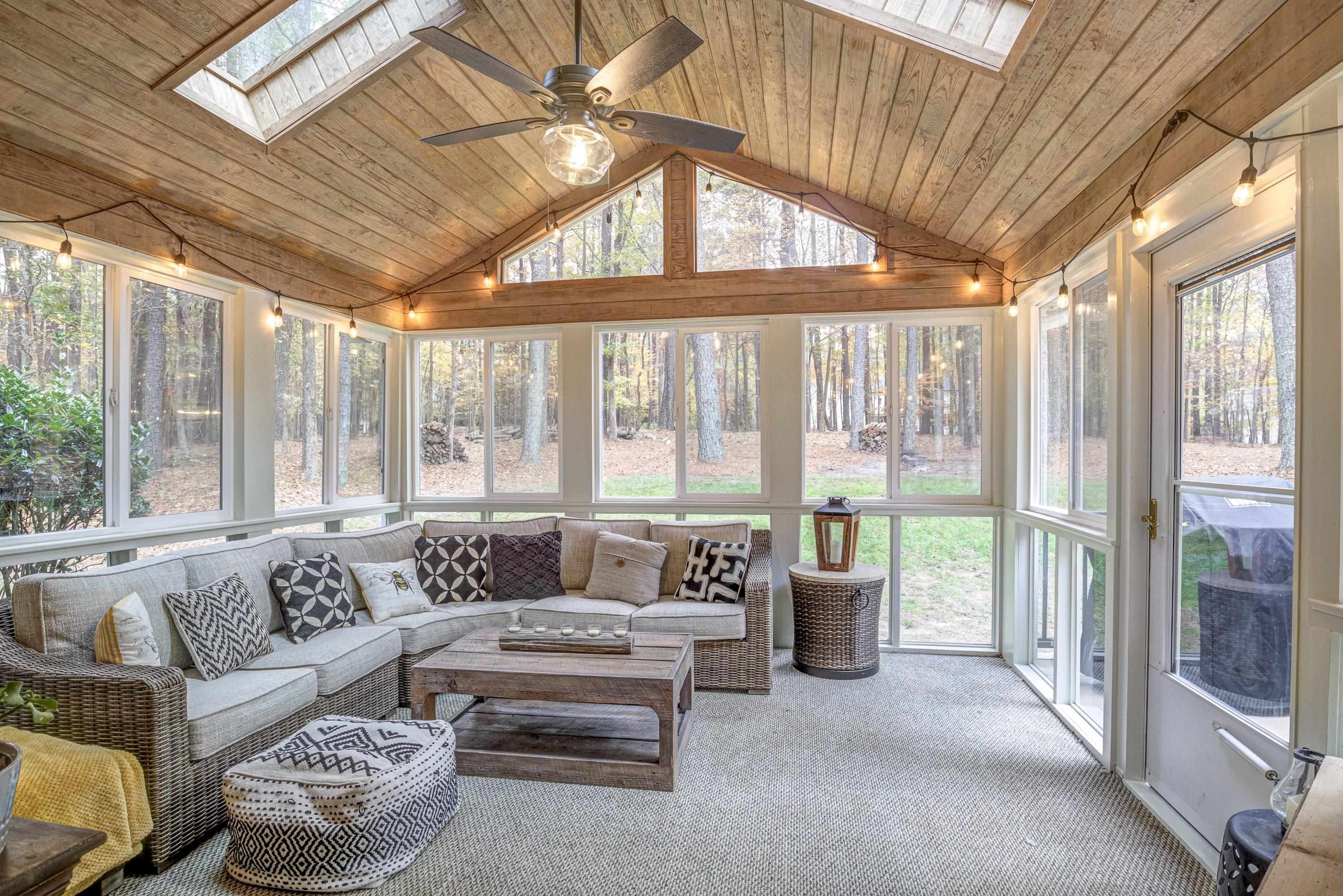 1413 Paumier Court Raleigh, NC 27615 - Photo 45 of 61 a living room with furniture and floor to ceiling windows