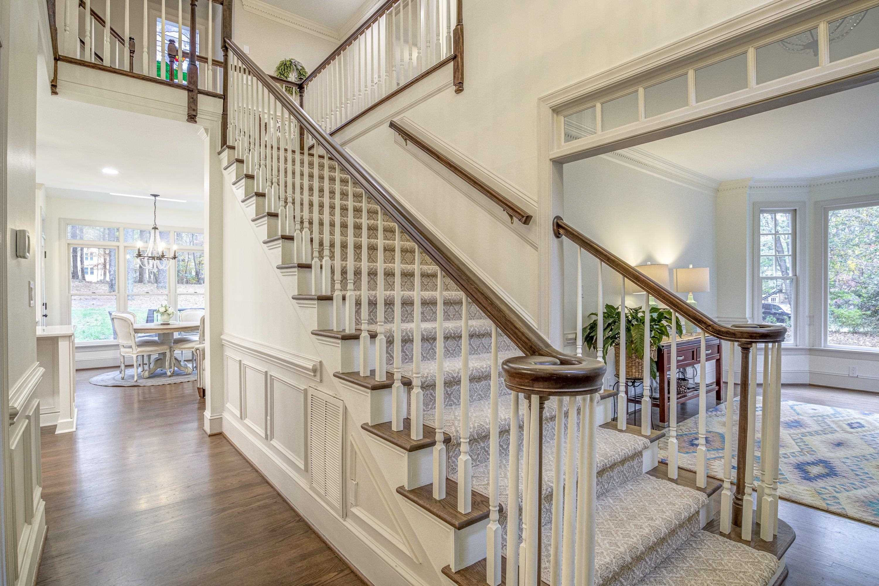 1413 Paumier Court Raleigh, NC 27615 - Photo 5 of 61 a view of entryway and hall with wooden floor