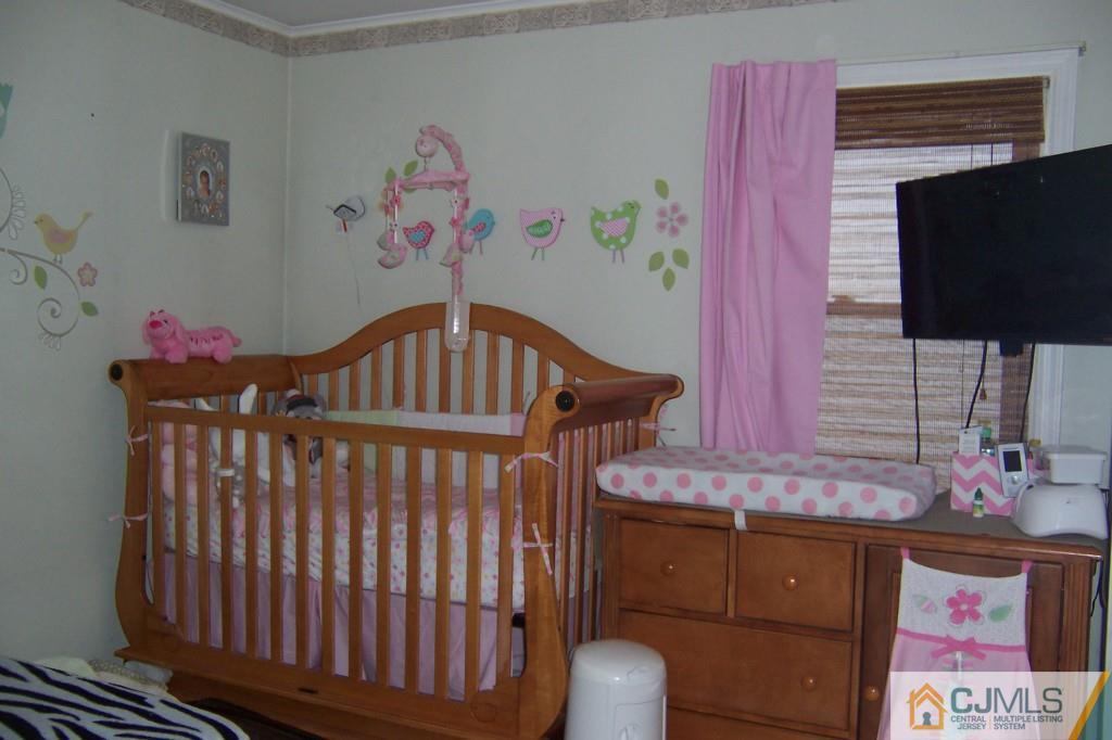 138 South Hill Road Colonia, NJ 07067 - Photo 13 of 25 a bedroom with furniture and a flat screen tv