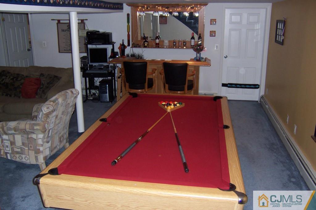 138 South Hill Road Colonia, NJ 07067 - Photo 17 of 25 a room with furniture and a flat screen tv