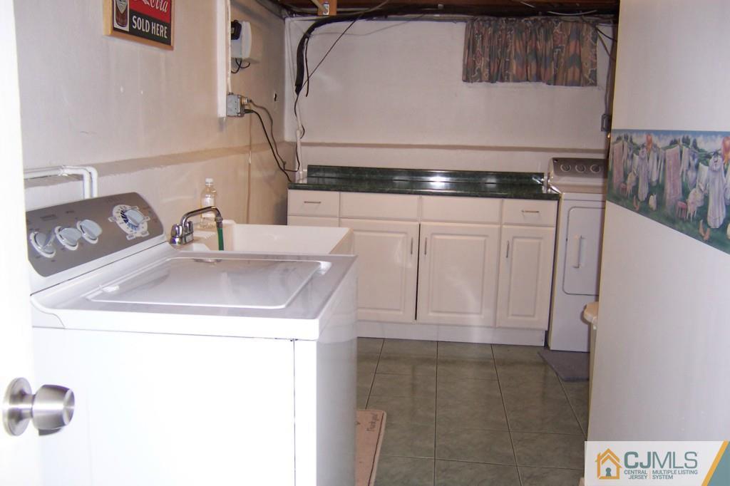 138 South Hill Road Colonia, NJ 07067 - Photo 20 of 25 a utility room with dryer and washer