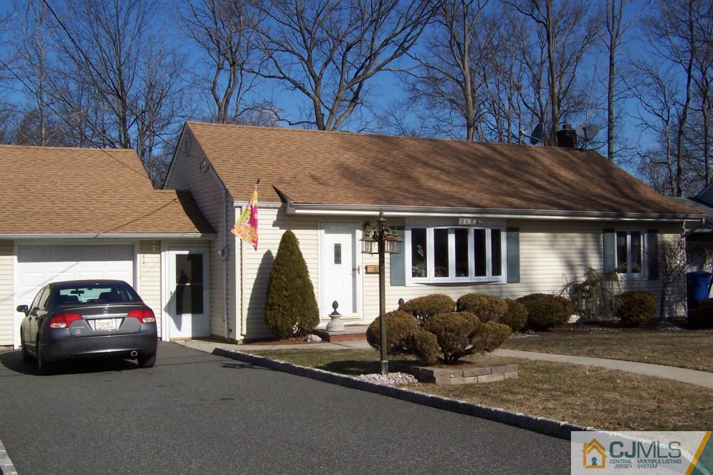 138 South Hill Road Colonia, NJ 07067 - Photo 25 of 25 a car parked in front of a house