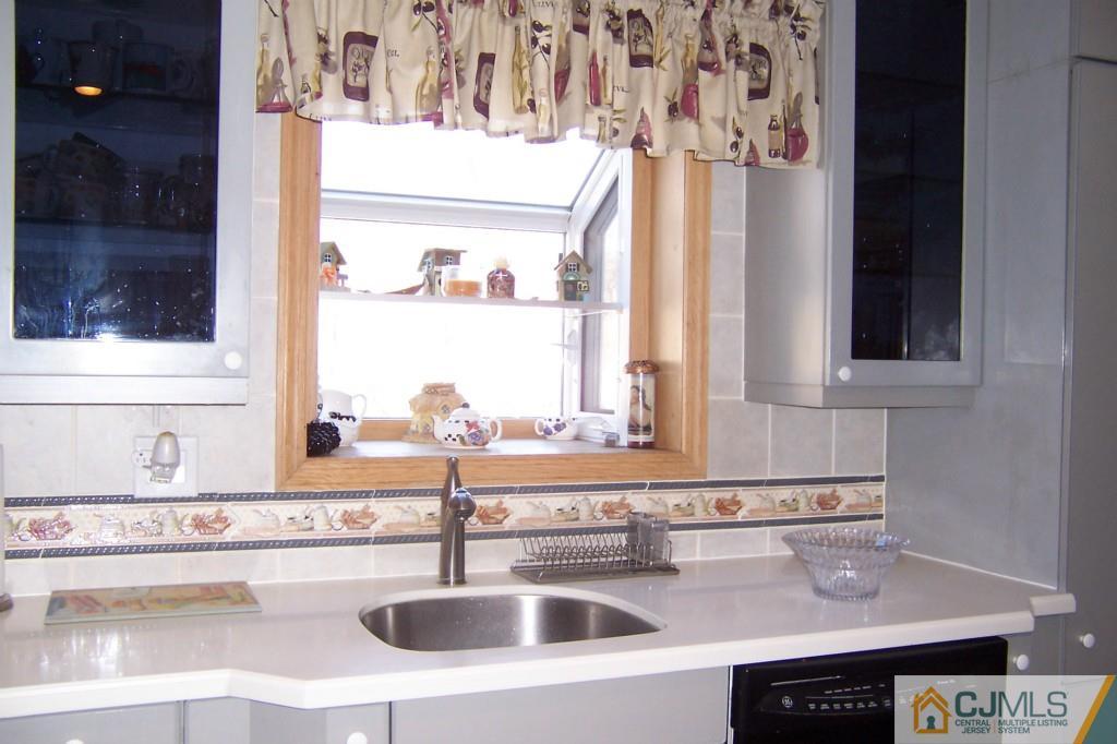138 South Hill Road Colonia, NJ 07067 - Photo 7 of 25 a bathroom with a sink and a mirror