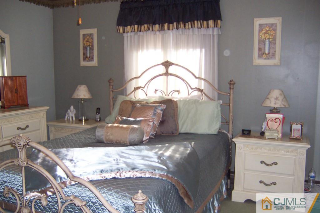 138 South Hill Road Colonia, NJ 07067 - Photo 10 of 25 a bed room with a bed and a television