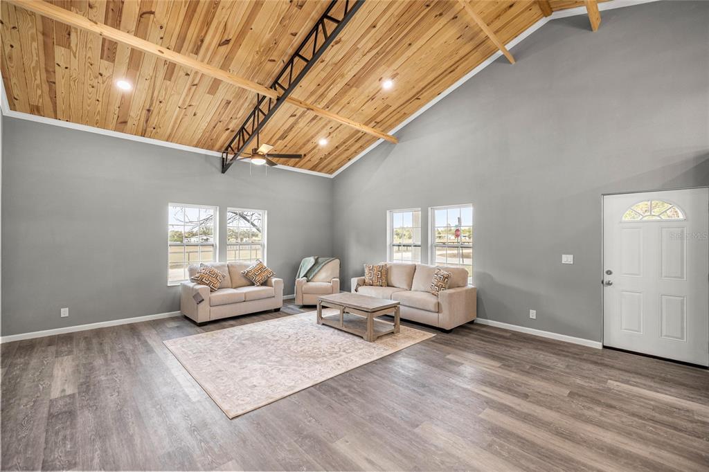 15010 Northeast 3rd Place Williston, FL 32696 - Photo 13 of 32 a living room with furniture and wooden floor