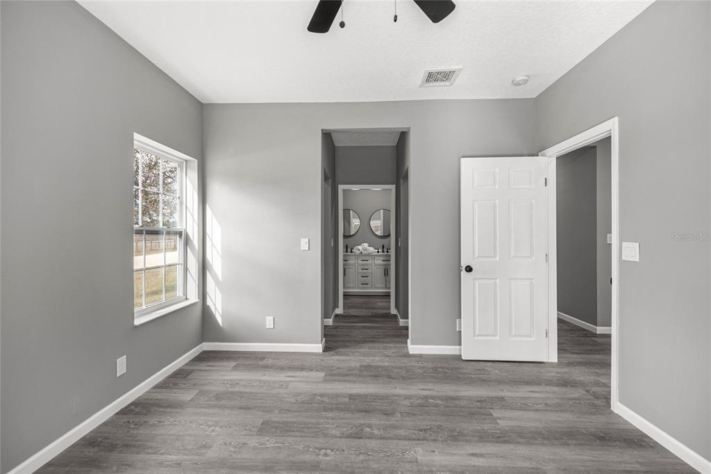 15010 Northeast 3rd Place Williston, FL 32696 - Photo 30 of 32 a view of an empty room with closet and windows