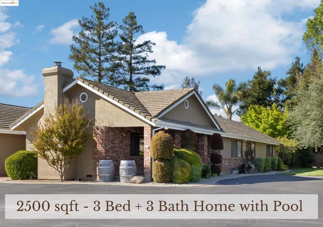 a view of a house with a street