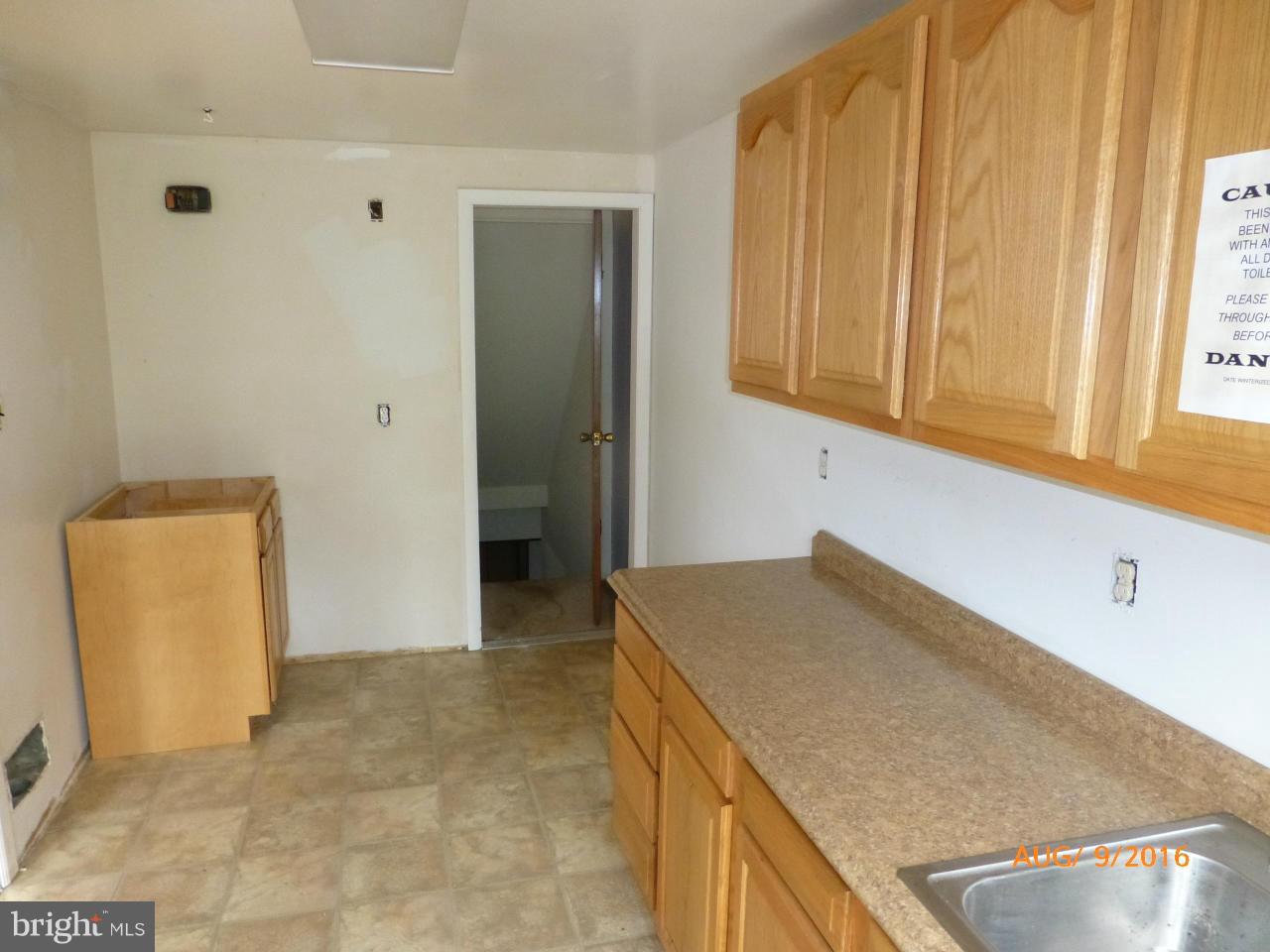 948 Bayner Road Baltimore, MD 21221 - Photo 8 of 15 a kitchen with granite countertop a sink a stove and a refrigerator