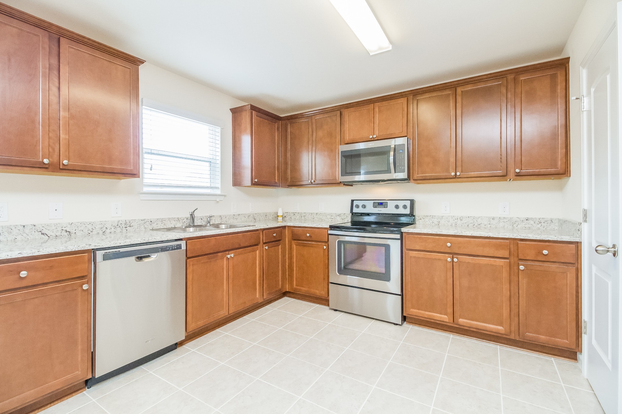 3309 Marichal Drive Murfreesboro, TN 37128 - Photo 5 of 15 a kitchen with granite countertop cabinets stainless steel appliances a sink and a window