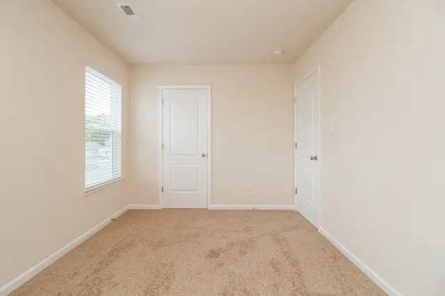 an empty room with windows