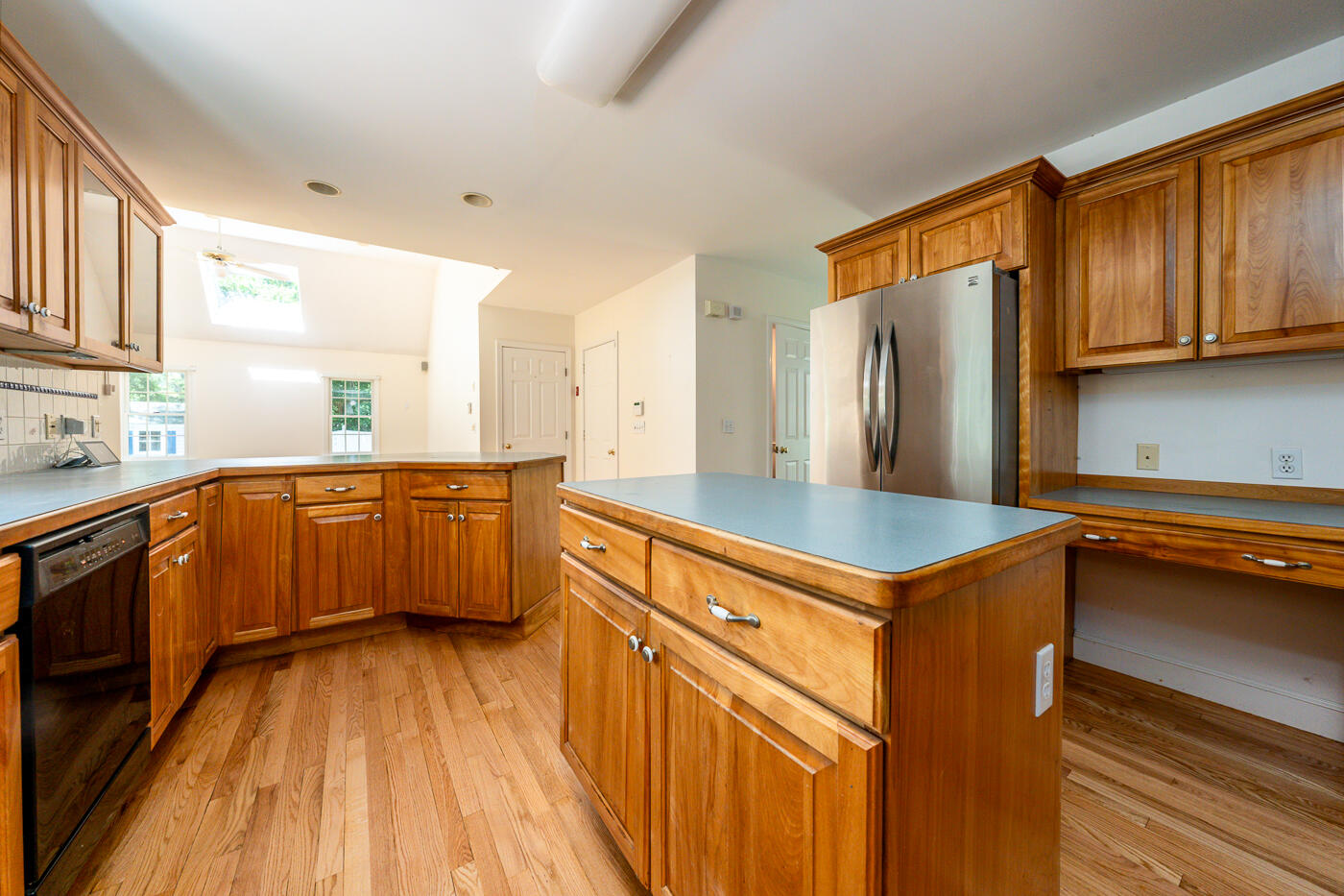 349 Little River Road Cotuit, MA 02635 - Photo 11 of 67 a kitchen with stainless steel appliances a sink cabinets and wooden floor
