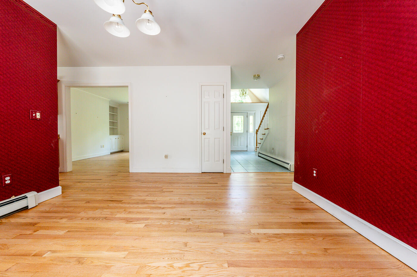 349 Little River Road Cotuit, MA 02635 - Photo 17 of 67 a view of a livingroom with wooden floor and a chandelier