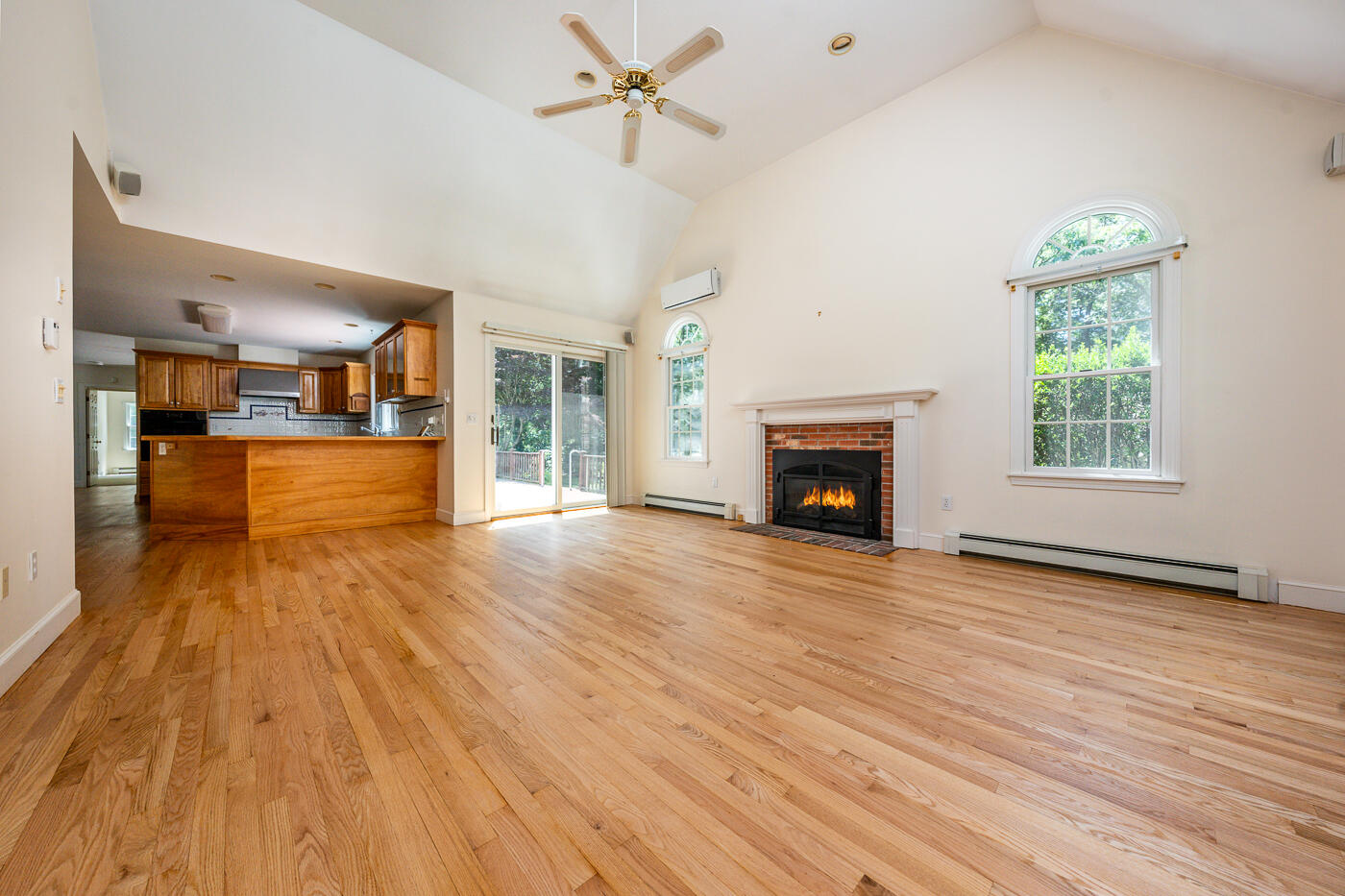 349 Little River Road Cotuit, MA 02635 - Photo 2 of 67 wooden floor fireplace and windows in an empty room
